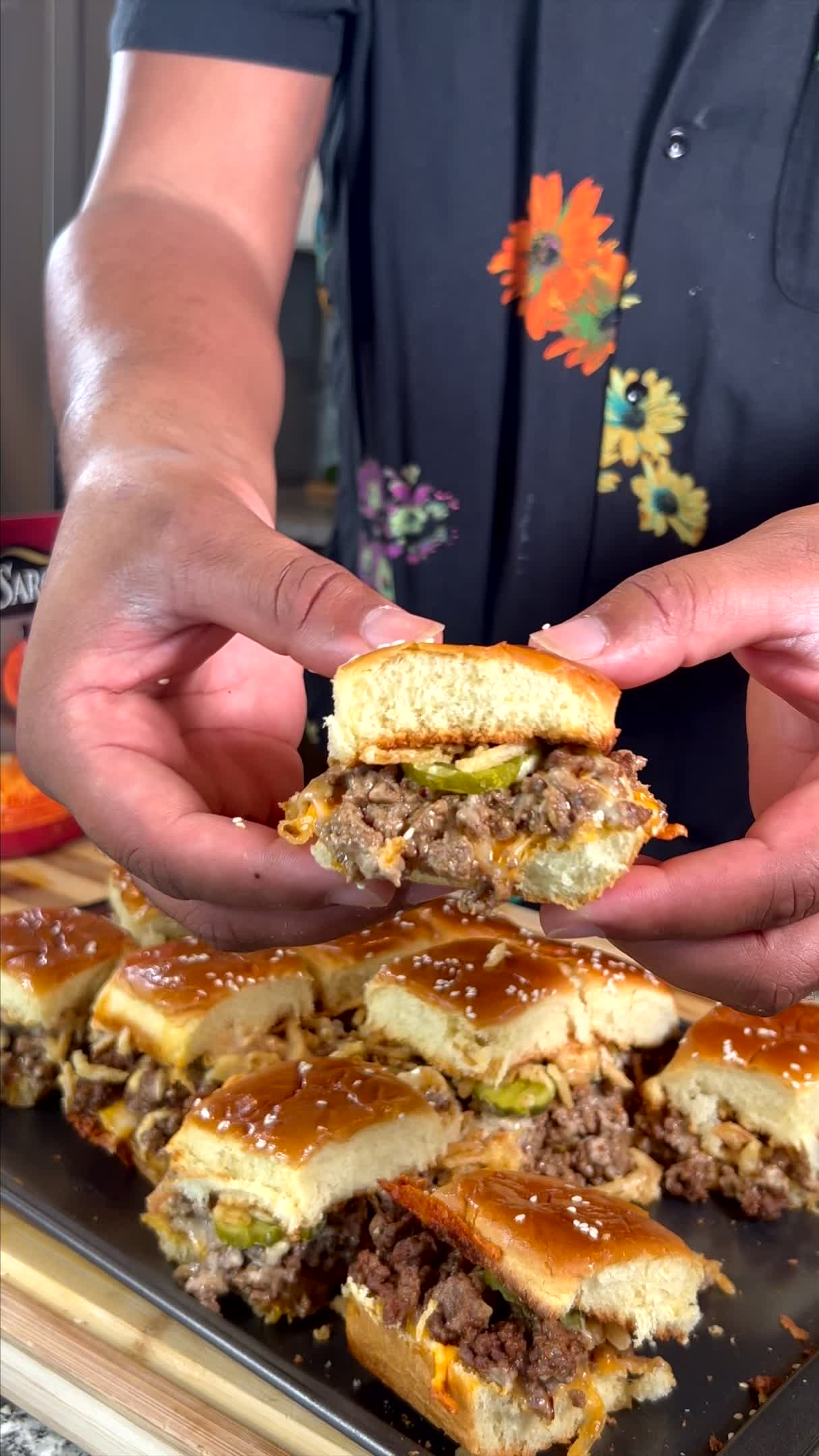 TikTok post by @chefkolbykash for Frank's RedHot. Caption reads: #SARGENTOPartner These Fiery Buffalo Cheeseburger....