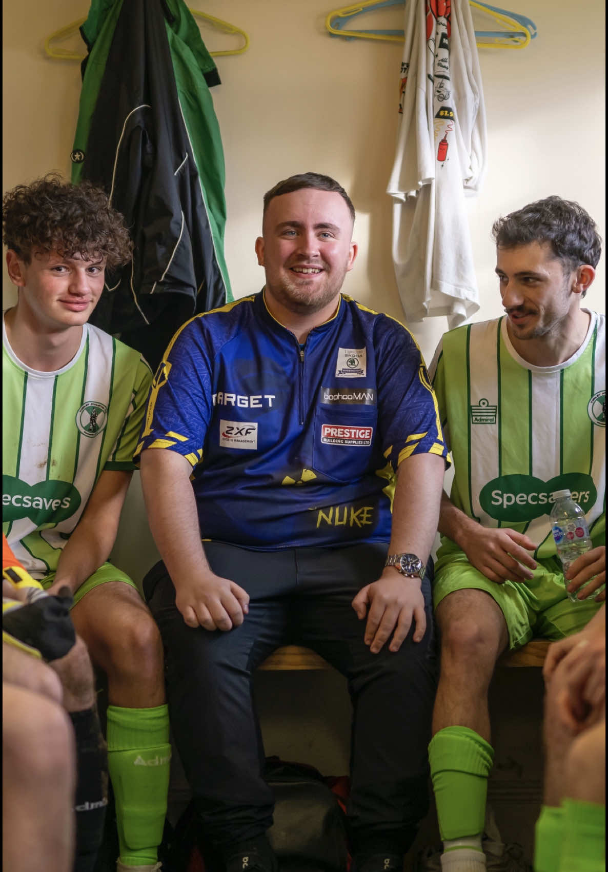 TikTok post by @lukethenukelittler for Specsavers. Caption reads: World darts champ 🆚 worst football team in the....