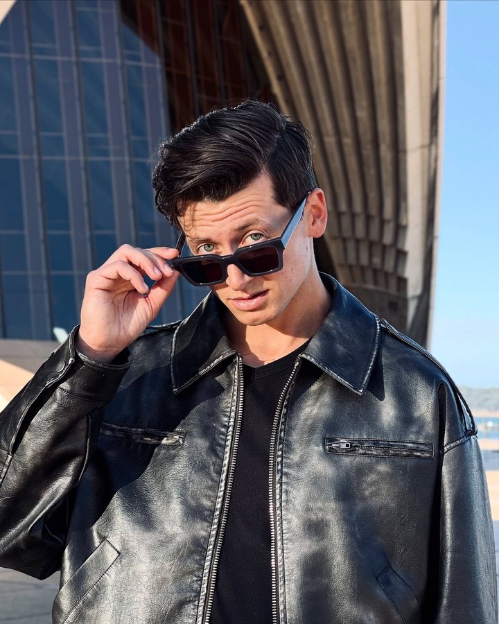 Instagram post by @sr_stanislas for Oscar Wylee Eyewear. Caption reads: Grey never looked so funky 👓✨ @oscarwylee These....