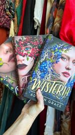Instagram post by @travelmomoirs for Orchard Corset. Caption reads: Did I mention historical vibe? 🥀 This book is on....