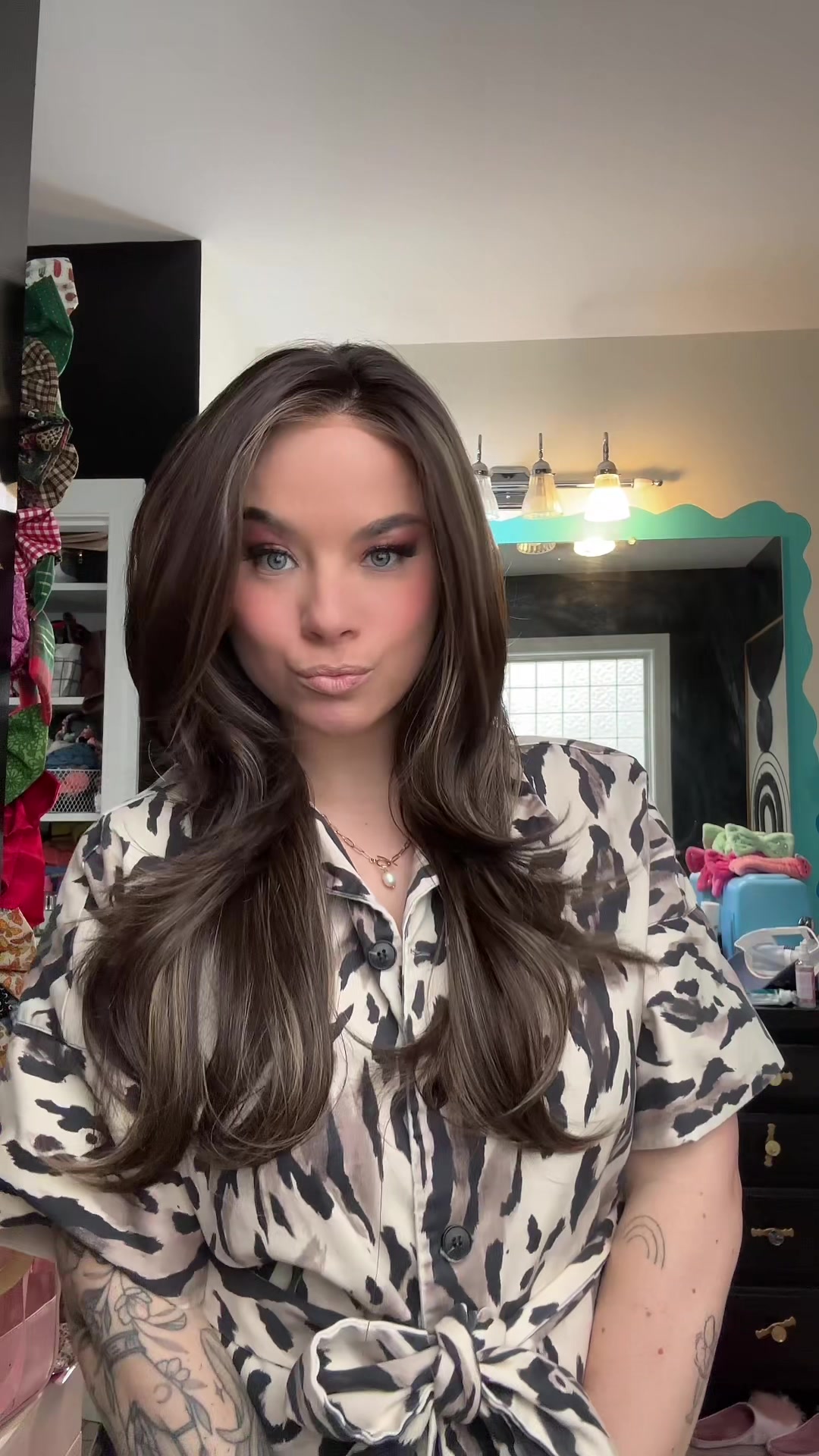 TikTok post by @elizabethwearswigs for Chelsey Smith Cosmetics. Caption reads: Love wearing wigs 💜 wig is Lala Brunette Beauty....