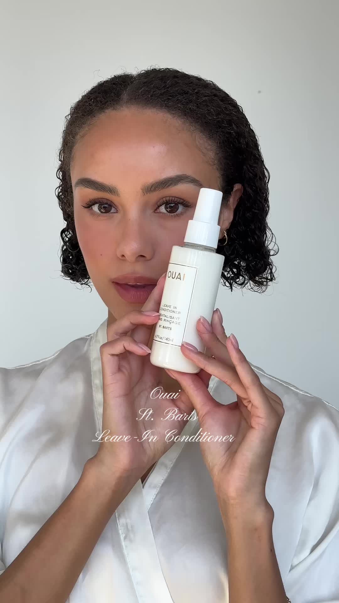 TikTok post by @oliviaamcdowell for OUAI. Caption reads: The limited edition @THE OUAI St. Bart’s leave-in....