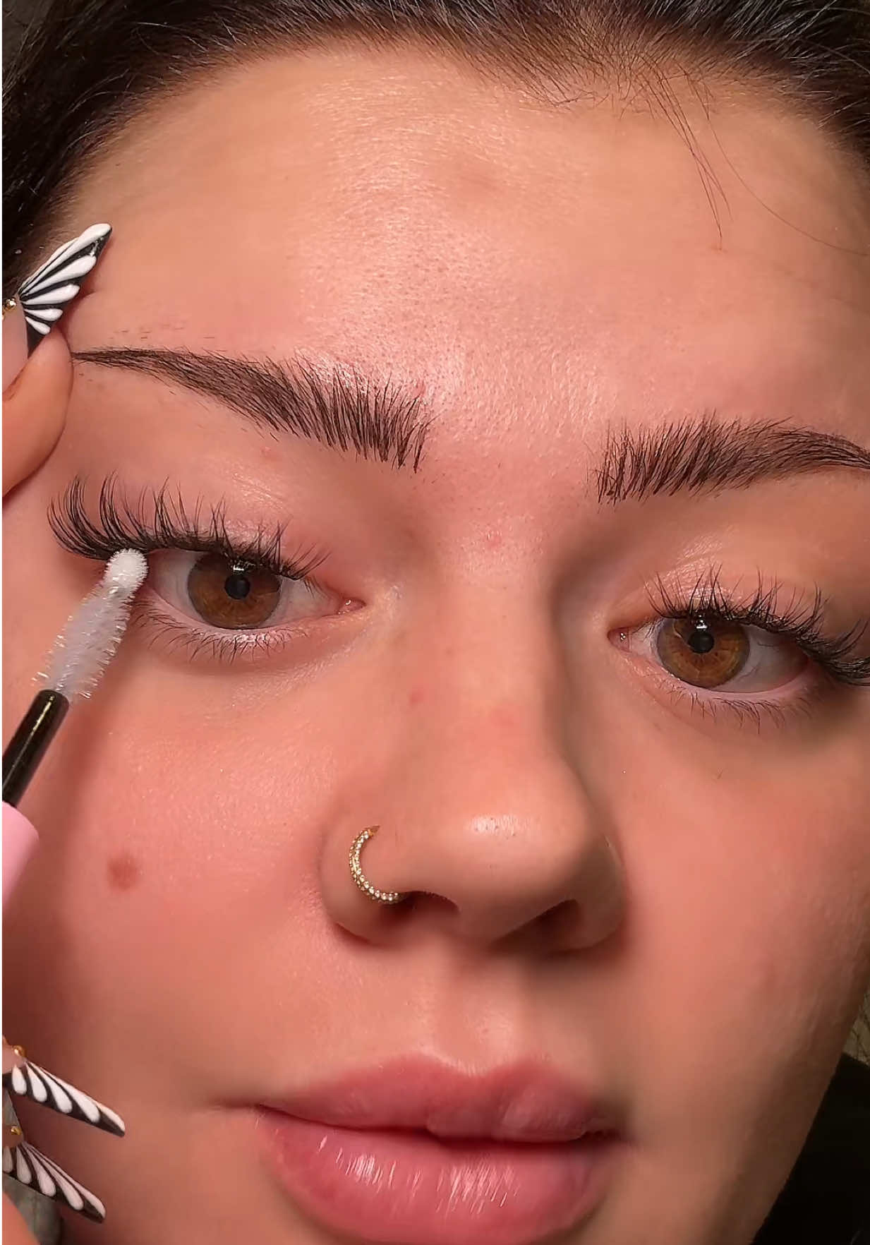 TikTok post by @kristidmytrenko for Eyeshine Cosmetics. Caption reads: Classic style lash clusters from @Eyeshine....