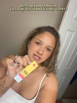 TikTok post by @brokepiercings for Base Laboratories. Caption reads: @Base Laboratories piercing bump HOLY GRAIL @Base....