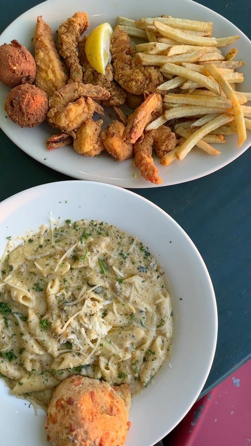 Instagram post by @hungry.heidi for Visit New Orleans. Caption reads: Dinner with a view? Don’t mind if I do! The Blue....
