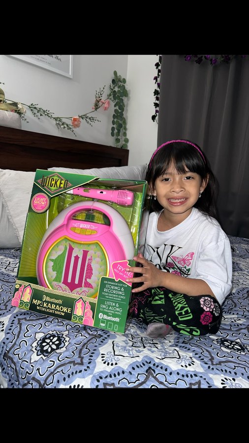 Instagram post by @princess.eva_ for eKids. Caption reads: Who else is a Wicked fan? 💗💚

Anyone can be a....