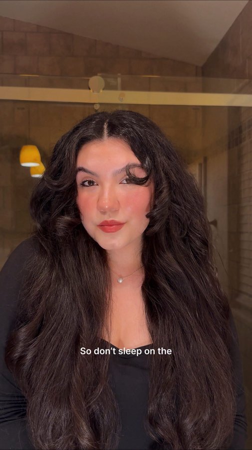 Instagram post by @13rianda for John Frieda. Caption reads: Frizz-free blowouts are easy to achieve thanks to....