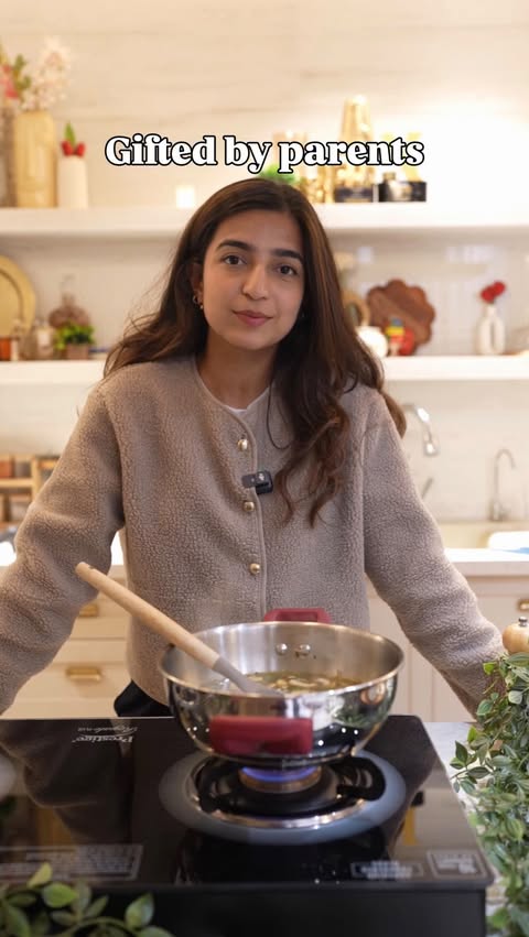 Instagram post by @withanushkarawat for TTK Prestige. Caption reads: [...] cooking motivation 🥹🫰🏼

Also,....