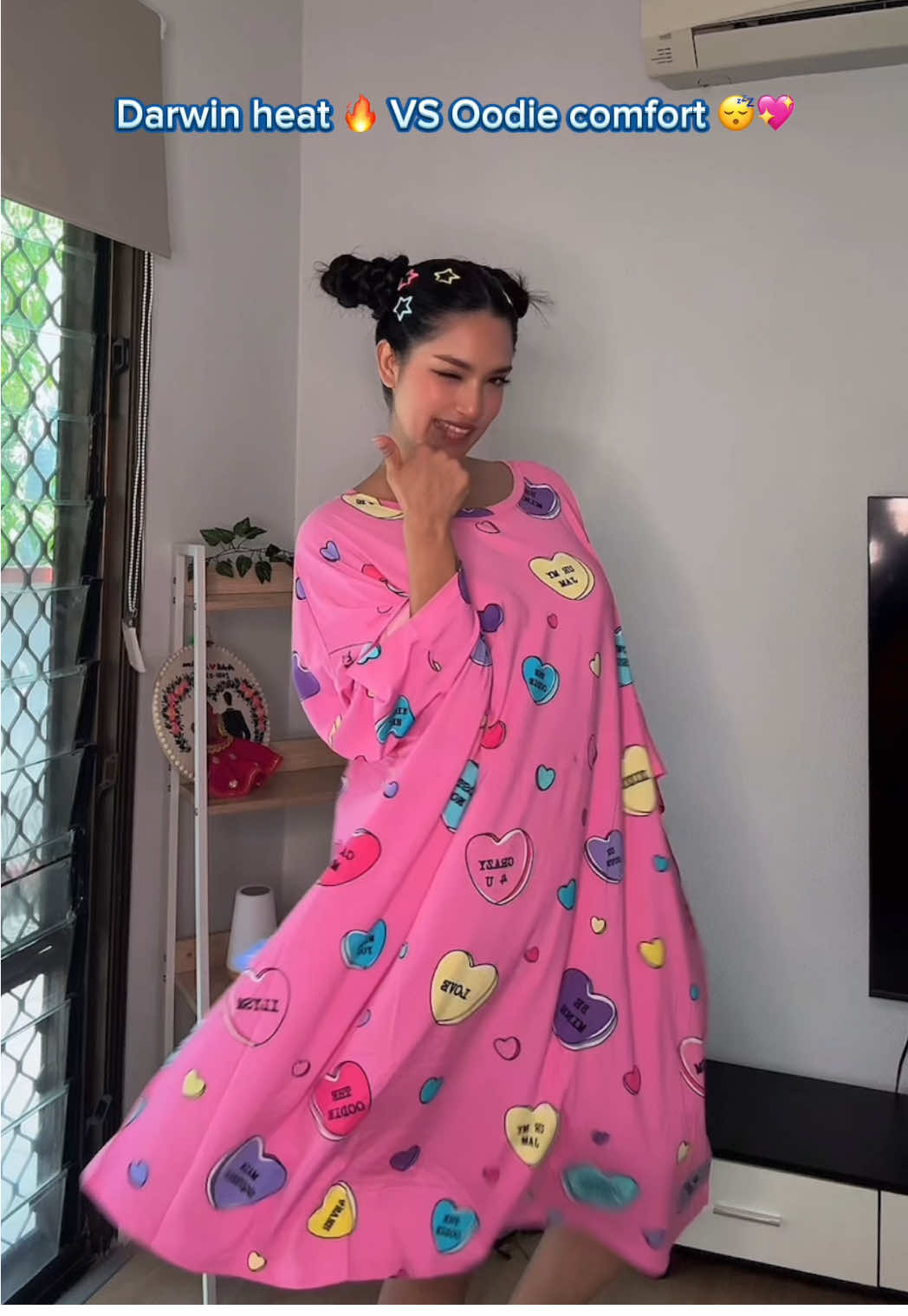 TikTok post by @muskanguragain for The Oodie. Caption reads: Roasting in Darwin 🔥 but my Oodie saved me .😎💛....