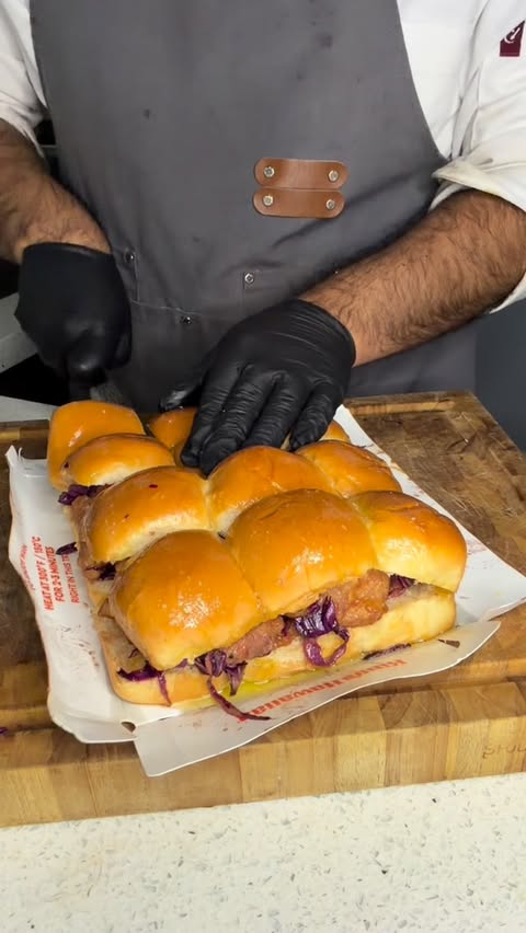Instagram post by @daniel.elcook for InnovAsian Cuisine. Caption reads: Crispy Honey Chicken sandwiches with fresh....