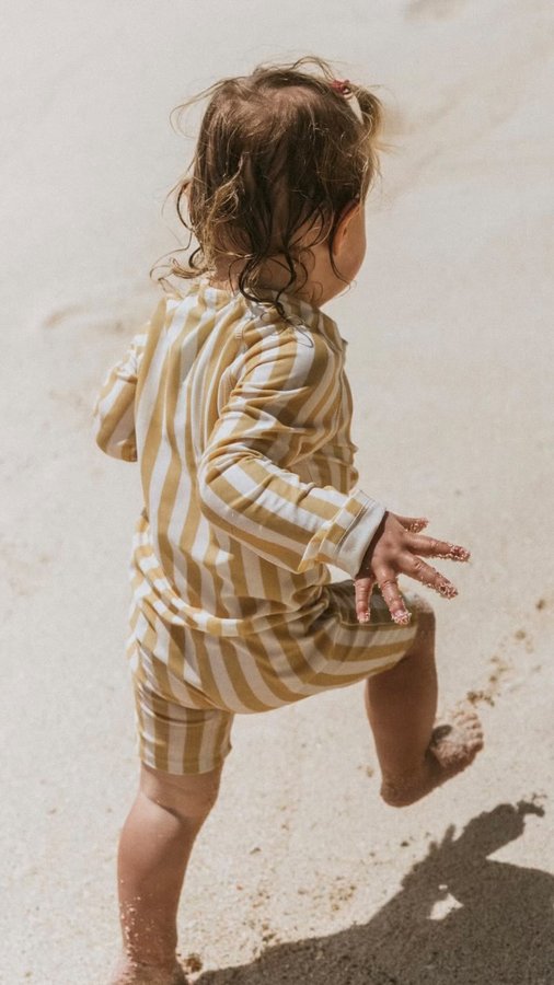 Instagram post by @philly.stokes for Hilton Hotels & Resorts. Caption reads: We loved spending the day at the beautiful beach....