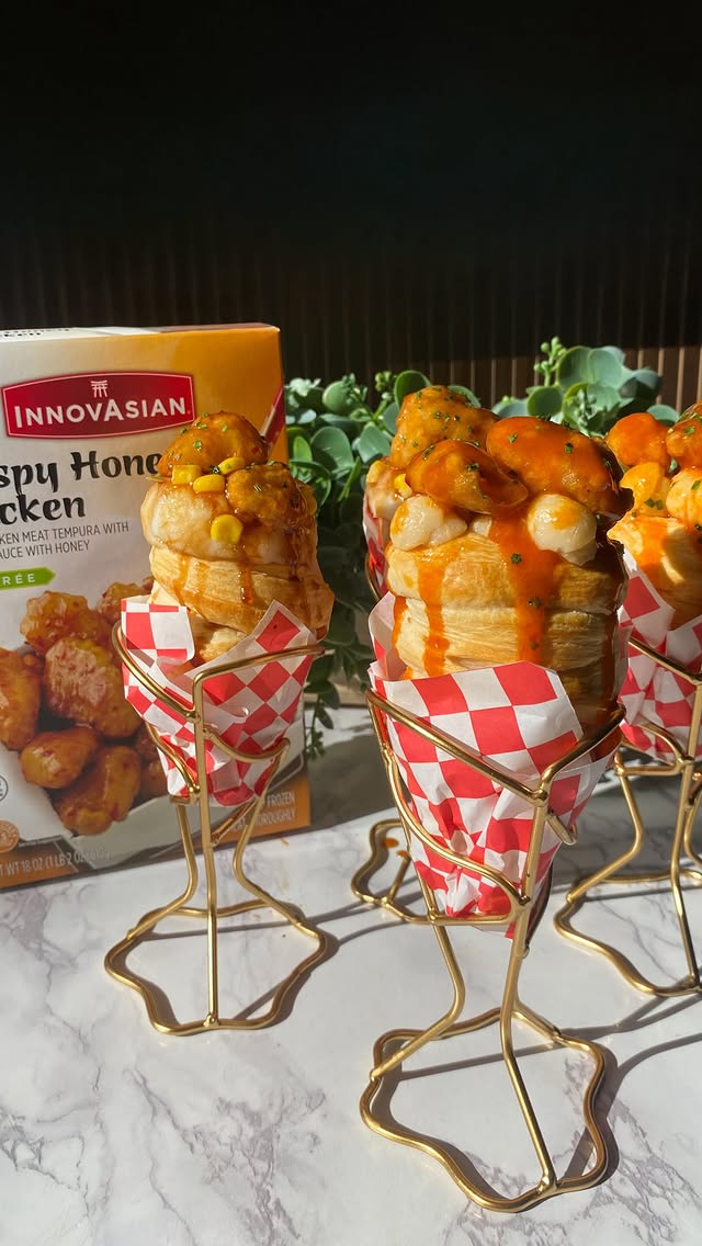 Instagram post by @shewillevolve for InnovAsian Cuisine. Caption reads: These Hot Honey & Buffalo Chicken Biscuit Cones....