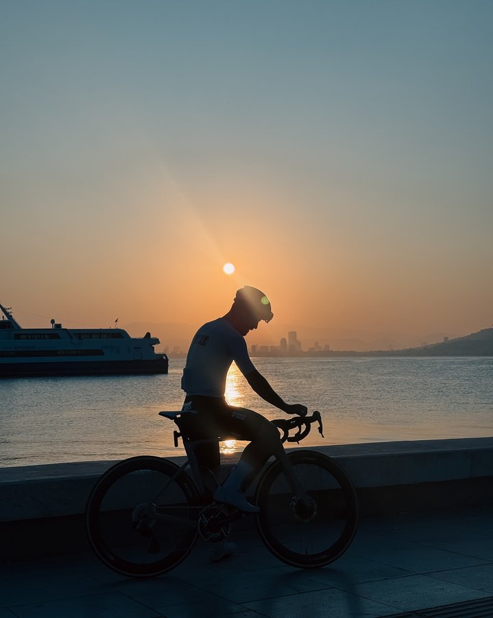 Instagram post by @wannabcyclist for SunGod. Caption reads: Early bird catches the good light....