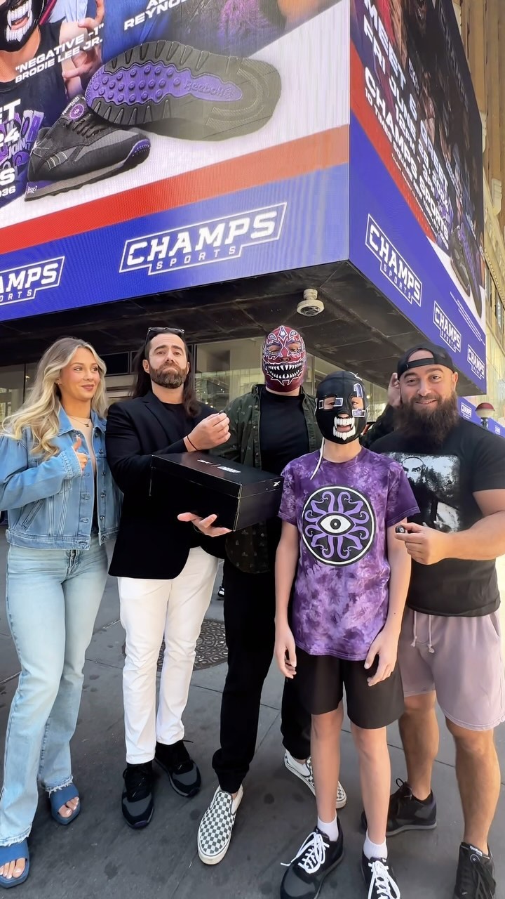 Instagram post by @ytalexreynolds for Champs Sports. Caption reads: Hey NYC AEW Fans! #DarkOrder have taken over Times....