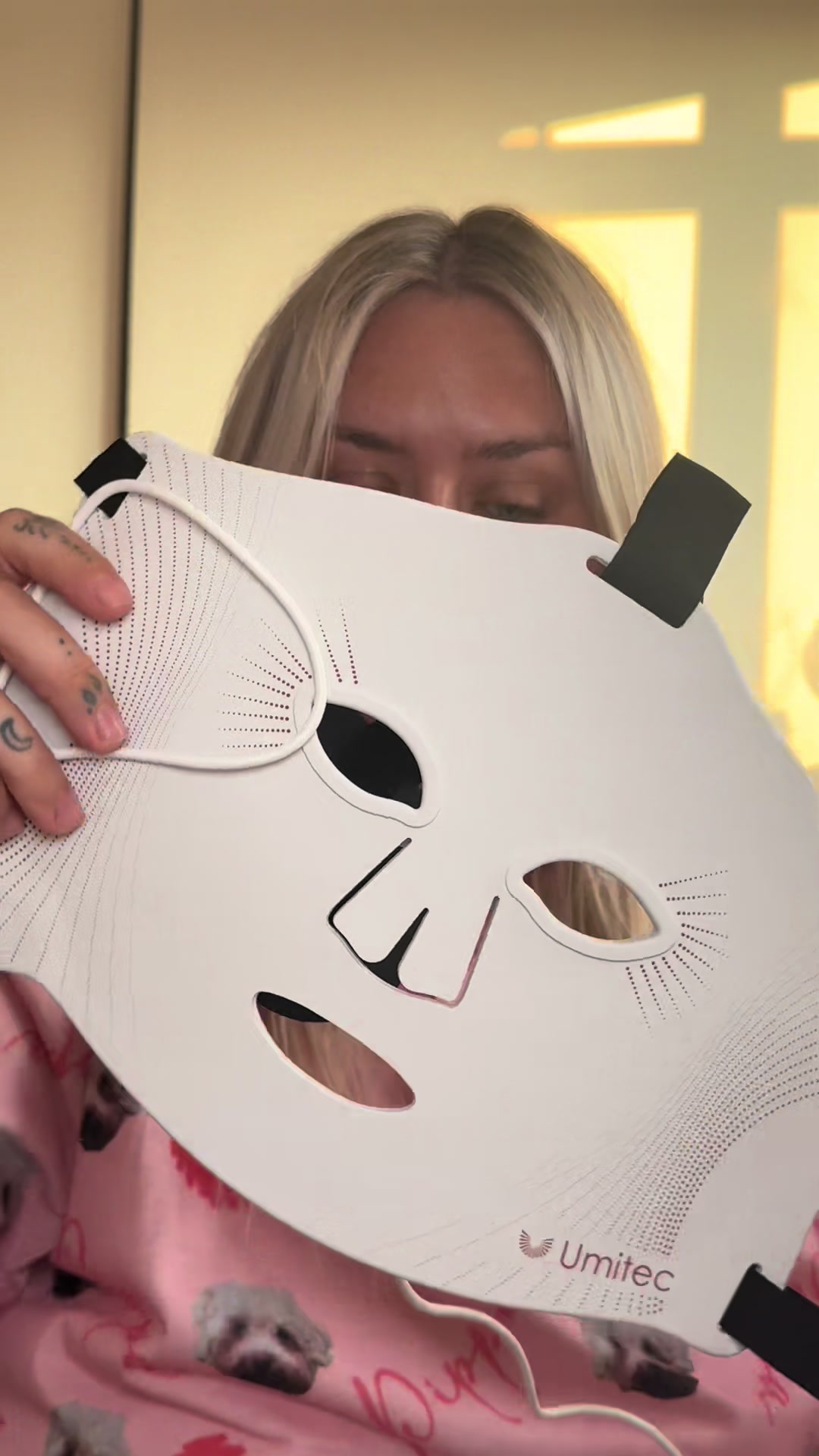 TikTok post by @kirstyjhxo for Umitec. Caption reads: @Umitec Shine Red Light LED Face Mask 🤍✨ How my....