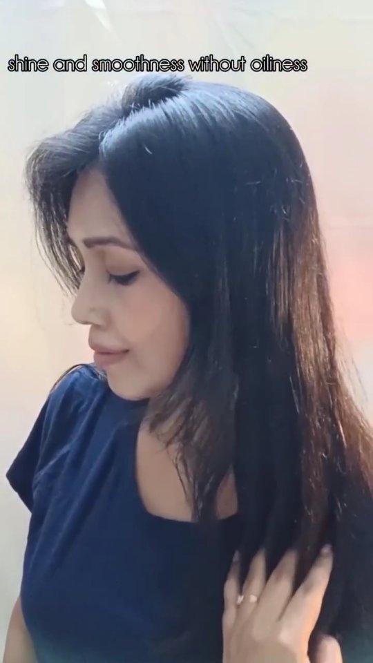 Instagram post by @glow_with_moumi for TRESemmé. Caption reads: Say goodbye to frizz and hello to flawless shine....