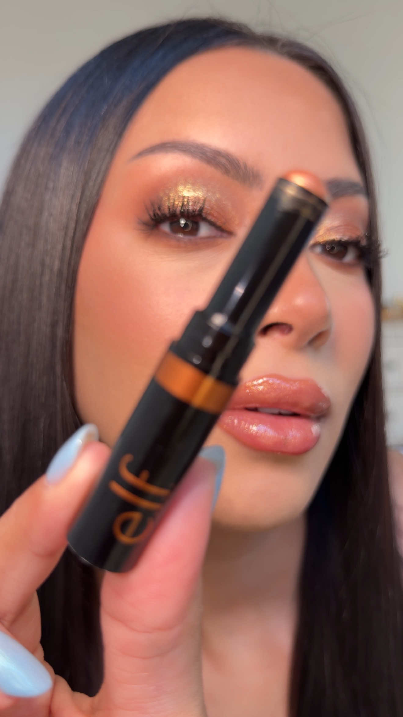 TikTok post by @glambervcruz for e.l.f. Cosmetics. Caption reads: Loving these @e.l.f. Cosmetics glitter eyeshadow....