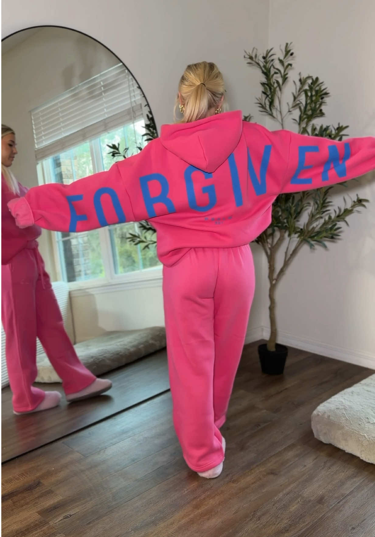 TikTok post by @alissalove_0 for God's Love Overcomes. Caption reads: [...] Love Overcomes Essential Hoodie....