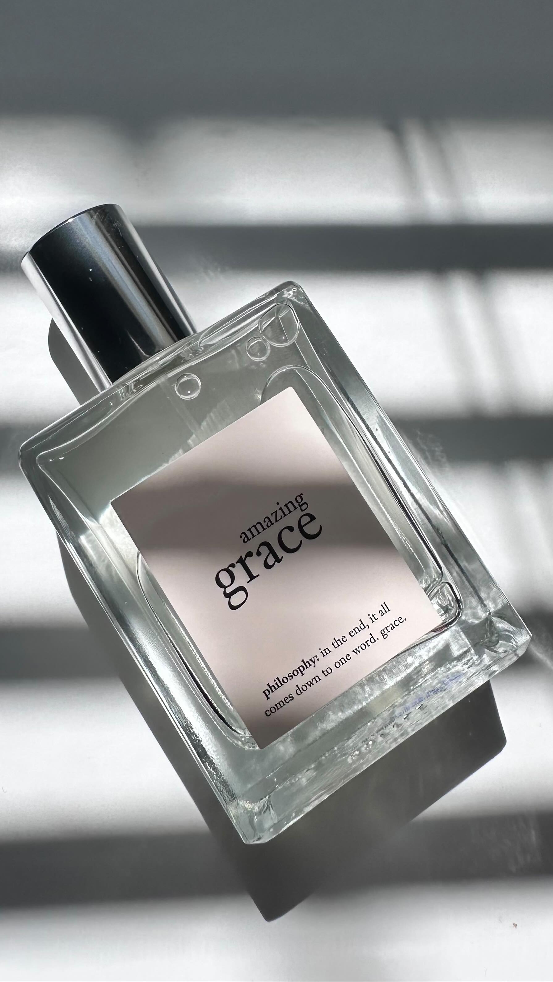 Instagram post by @jossesther for philosophy. Caption reads: Soft, clean, and timeless 💕🌸Amazing Grace by....