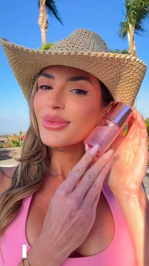 Instagram post by @caitlin_jwood for JLO BEAUTY. Caption reads: @jlobeauty just launched their GLOW MIST! It’s....