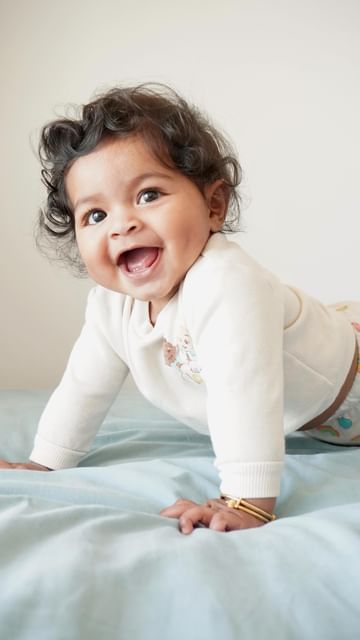 Instagram post by @deepthi.bhat for Dreamland Baby. Caption reads: Happy Friday everyone 🧸☀️ #ootd #fashion #baby.
