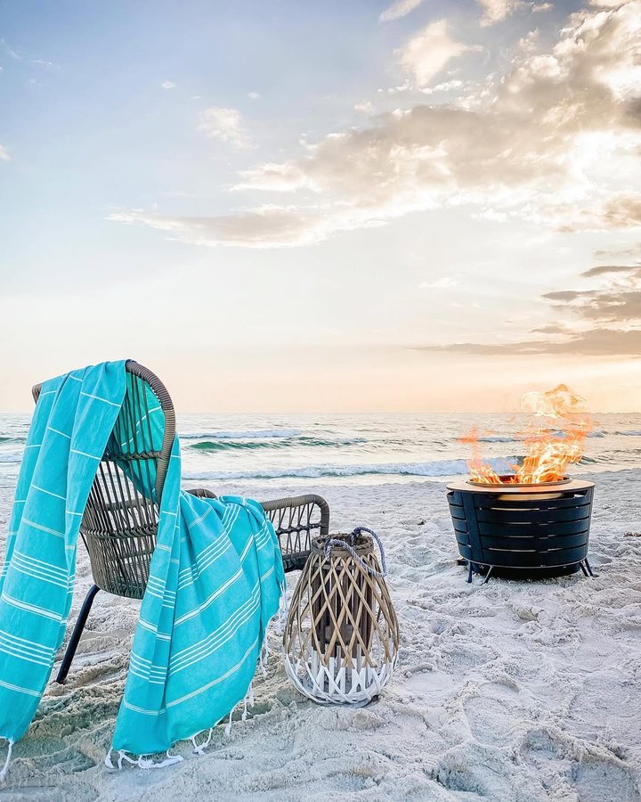 Instagram post by @theclevergoose for Southern Living. Caption reads: Have you ever had a bonfire on the beach? It’s one....