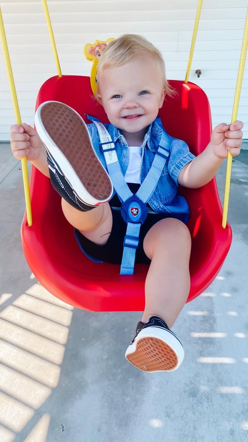 Instagram post by an influencer for Delta Children. Caption reads: [...] Loving our new swing from @deltachildren! It....