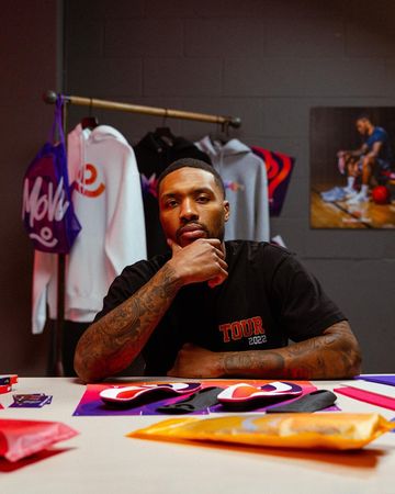 Instagram post by @damianlillard for Move. Caption reads: 👀 Cooked up some #CyberMonday deals with....