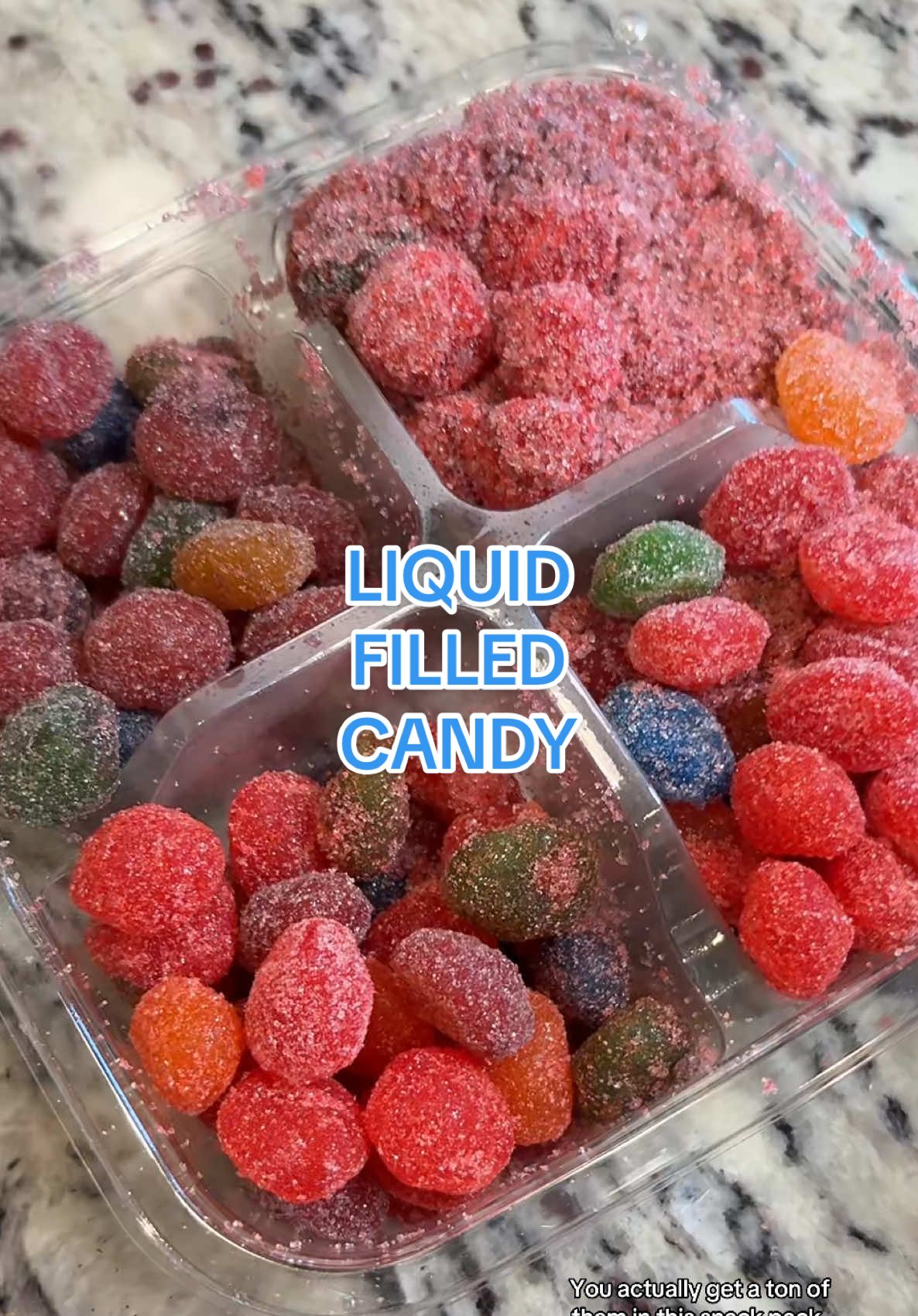 TikTok post by @lifethroughemma for Mama V’s Candy. Caption reads: 🍬I can’t stop eating these liquid filled candies!....