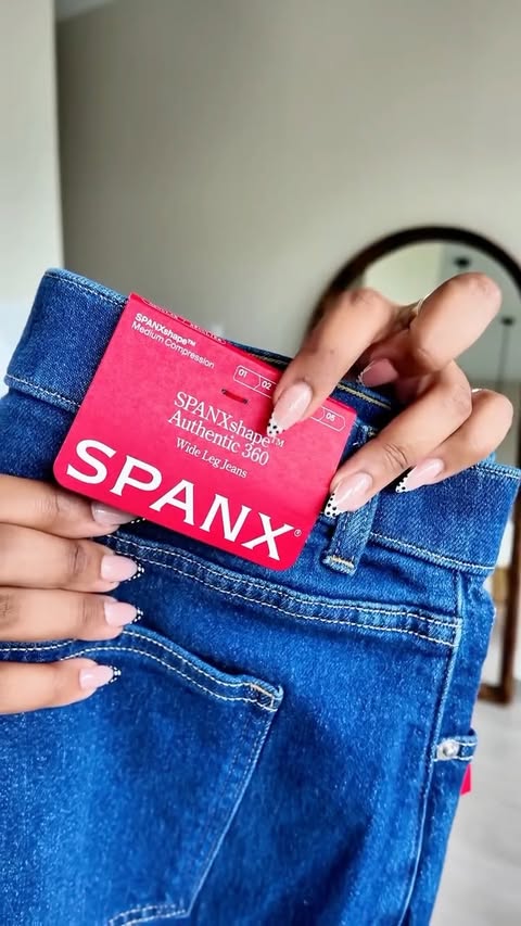 Instagram post by @conqueringasya for SPANX. Caption reads: When I say @spanx makes the best jeans THIS is....
