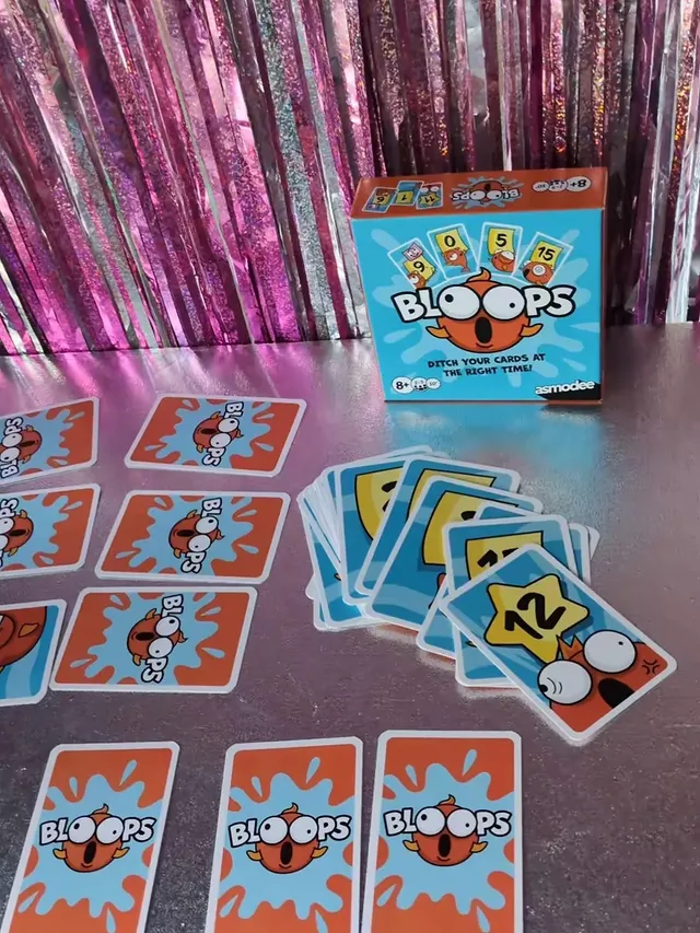 Instagram post by an influencer for Asmodee UK. Caption reads: [...] #asmodee #cardgame #newgames @asmodeeuk.