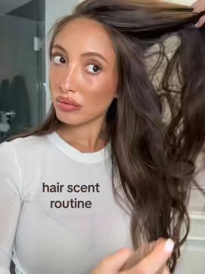 TikTok post by @vvkaplan for Emi Jay. Caption reads: [...] scent layering routine 🧸🍨🫶🏼🍂🛁 @Emi Jay....