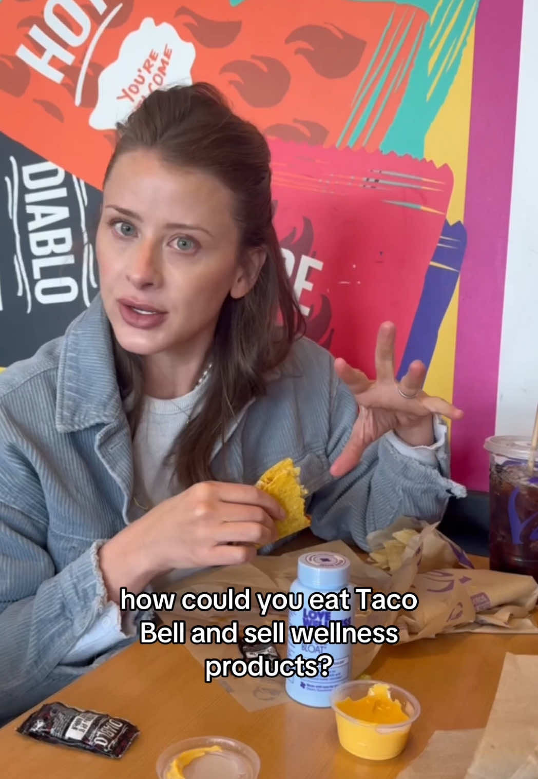 TikTok post by @lobosworth for Love Wellness. Caption reads: [...] eat the tacos 🌮 @tacobell @lovewellness.