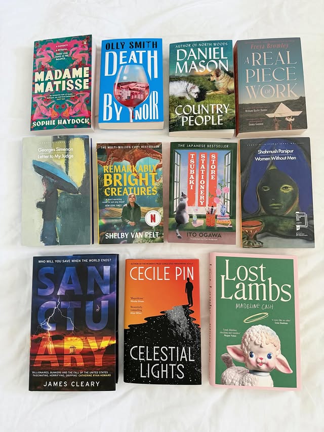 Instagram post by @mitsy_reads for Penguin Random House. Caption reads: Happy Friday, bookworms! Today’s book flatlay....