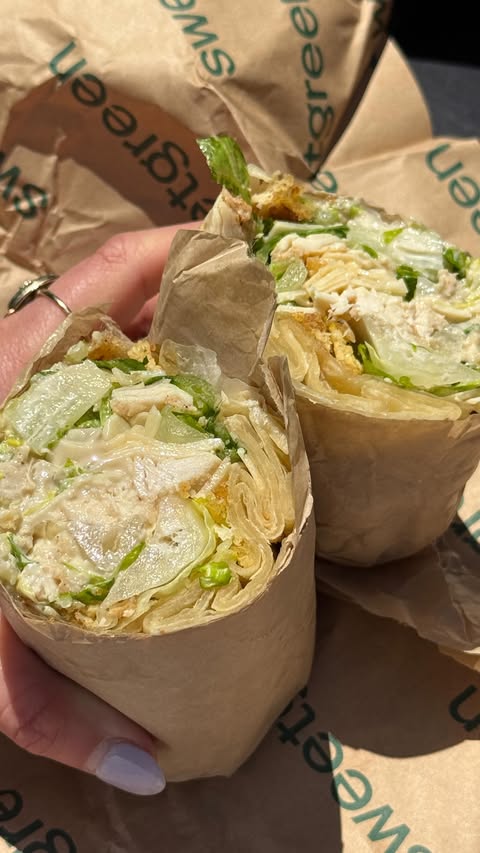 Instagram post by @dishinwithdelaney for sweetgreen. Caption reads: @sweetgreen has wraps, aka handheld salads!!! 📍....