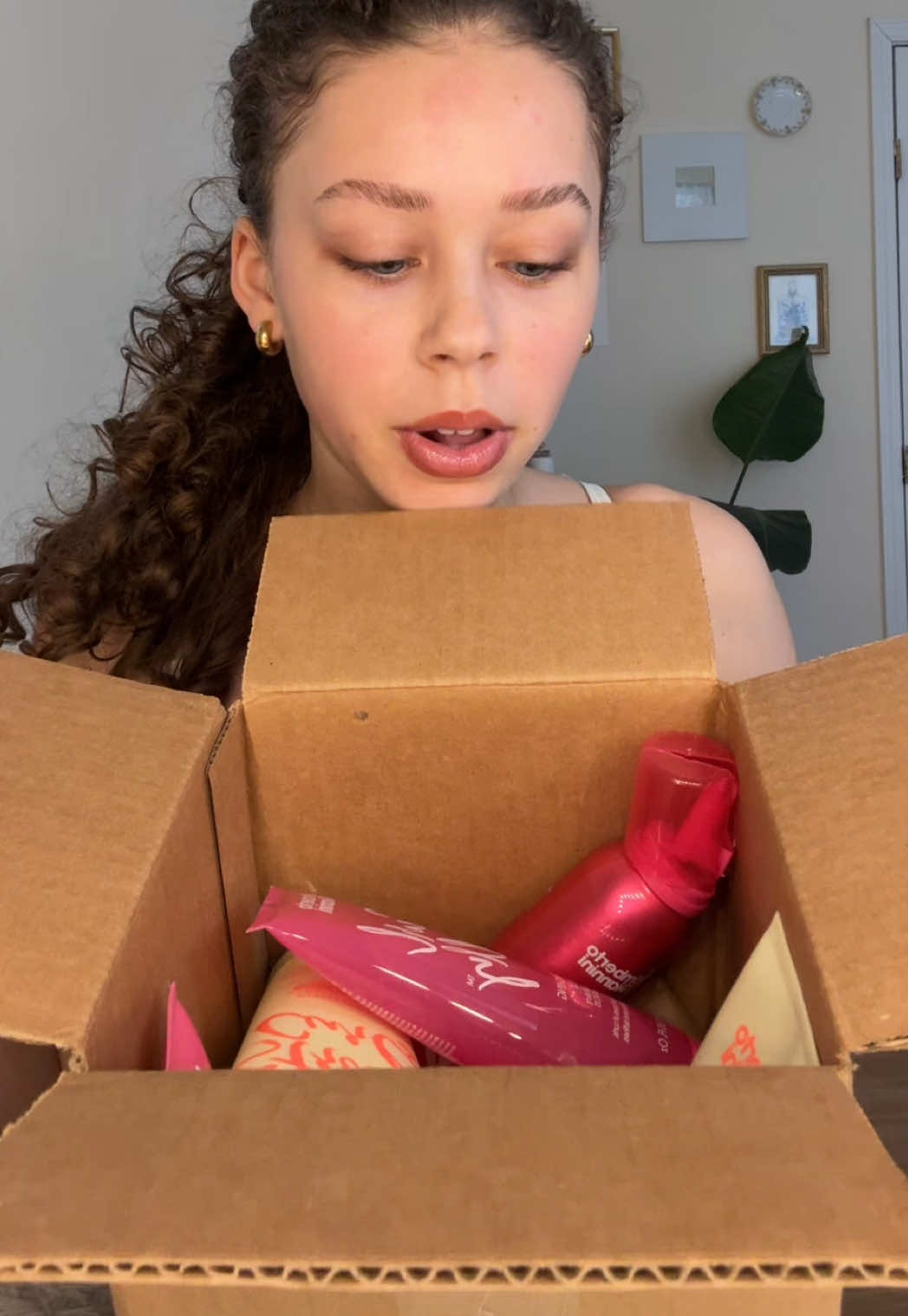 TikTok post by @thatgirlwiththecurlyhair for UMBERTO GIANNINI. Caption reads: Thank you @Umberto Giannini 🩷.