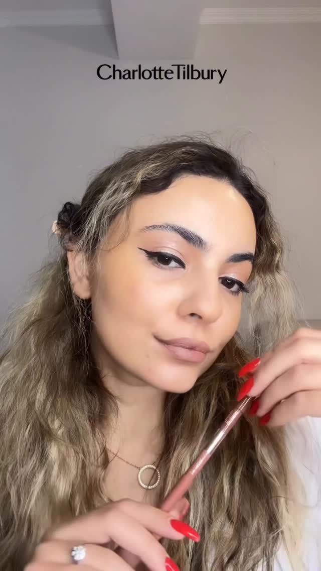 Instagram post by @zaalishvili_zalina for Charlotte Tilbury. Caption reads: Fav Lip Cheat Contour Duo Lip Liner....