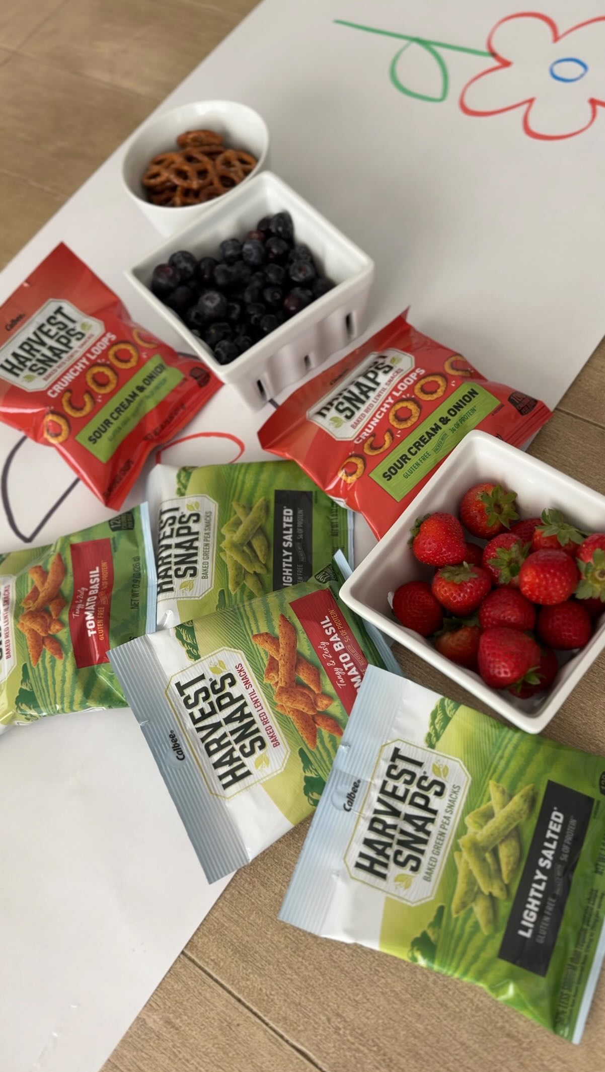 Instagram post by @tealacravy for Harvest Snaps. Caption reads: Color Me Charcuterie ft. @harvestsnaps 🫛🍅🧅
#ad....