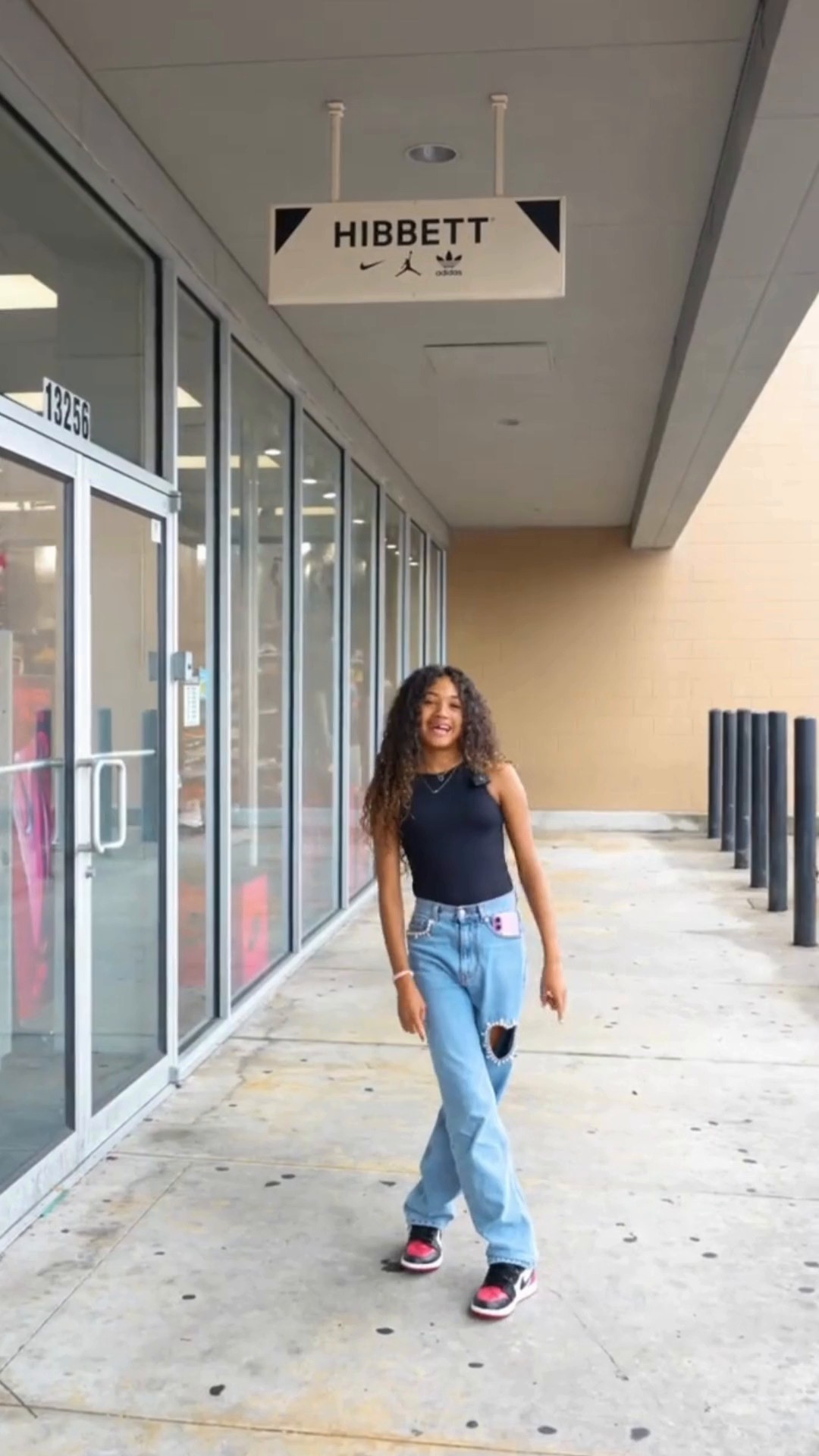 Instagram post by @missroyaltybrown for Hibbett. Caption reads: Sneaker shopping in H-Town 👟 with....