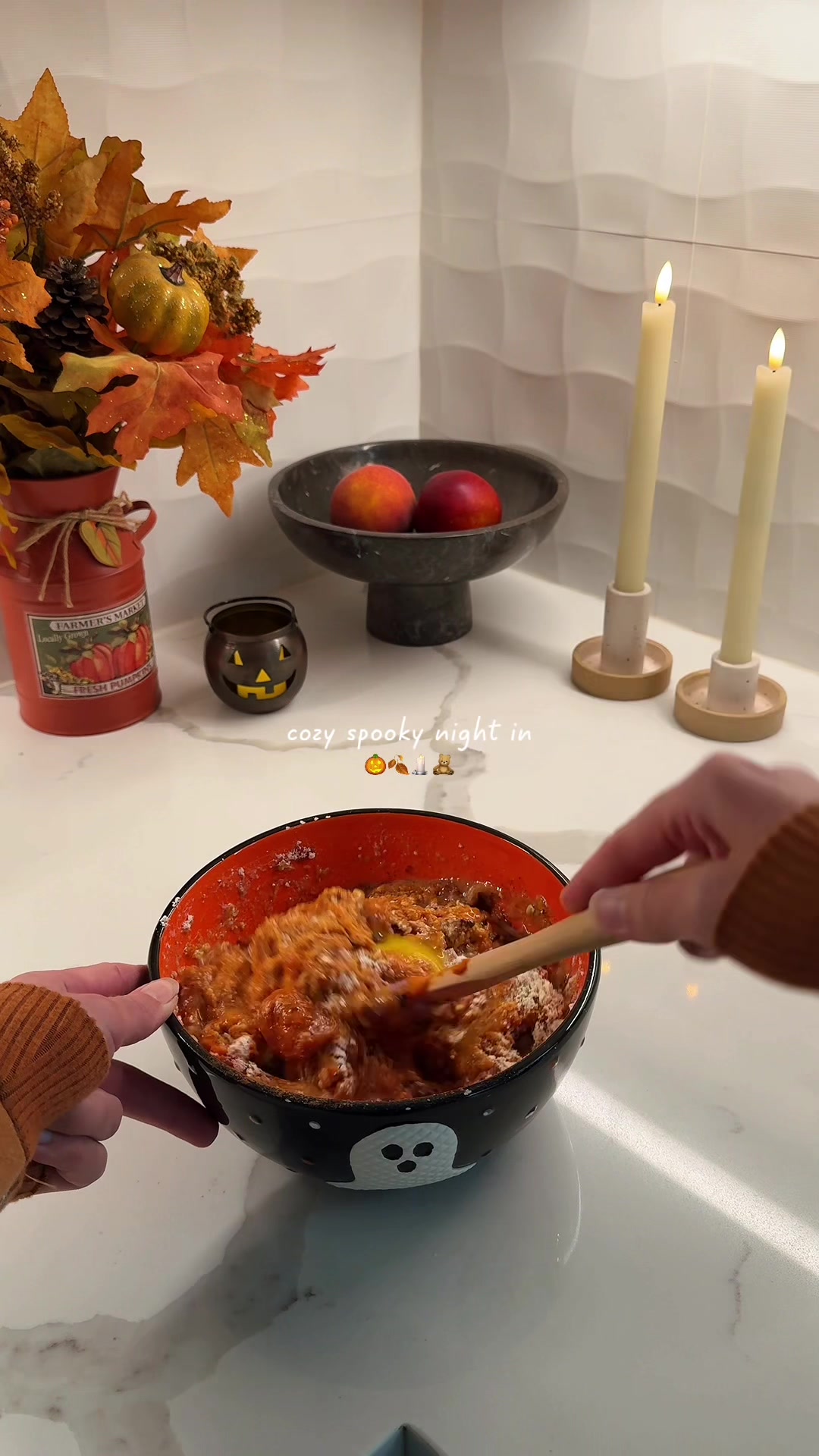 TikTok post by @emma.hussung for Hu Kitchen. Caption reads: Cozy Halloween vibes at home 👻 pretending it’s....