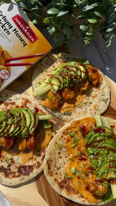 Instagram post by @shewillevolve for InnovAsian Cuisine. Caption reads: These Honey Chicken Scallion Wraps with creamy....