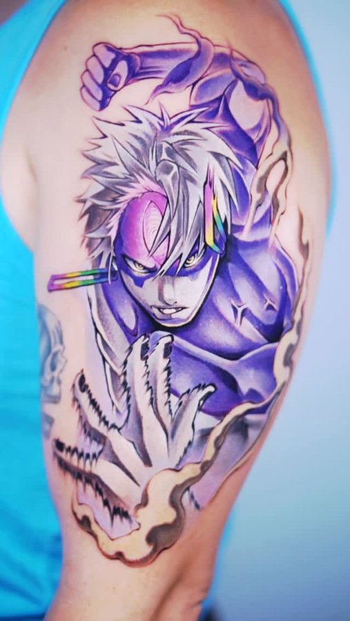 Instagram post by @davidesettattoos for EZ Tattoo Supply. Caption reads: Jiji evil eye tattoo Dandadan for @lexie.wohlfort....