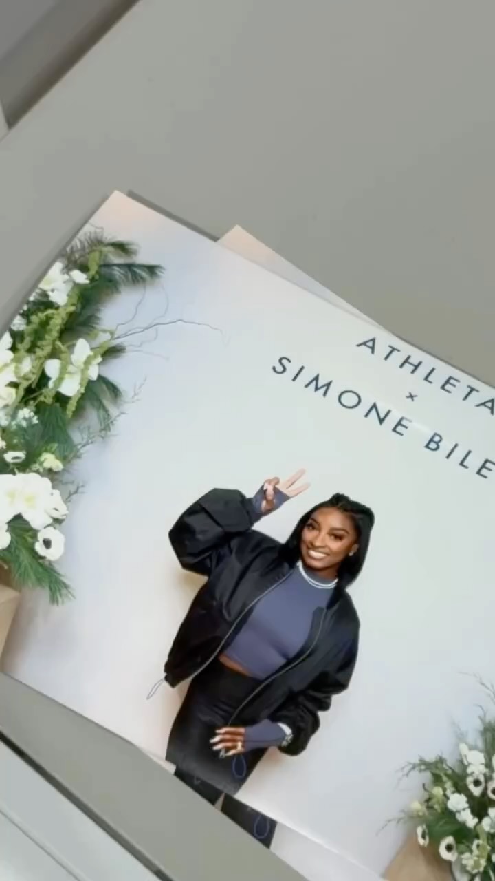 Instagram post by @simonebiles for Athleta. Caption reads: It’s official: our latest collab with @simonebiles....