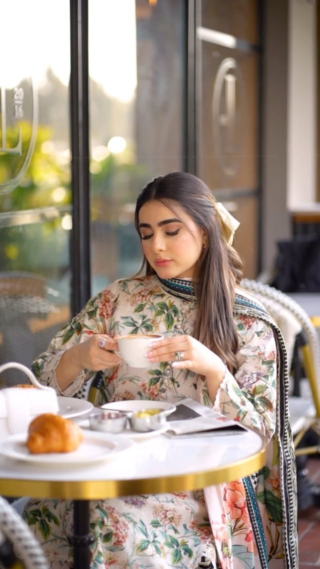 Instagram post by @rafyaminhas for EGO. Caption reads: EGO x @rafyaminhas Unstitched Spring Summer [...].