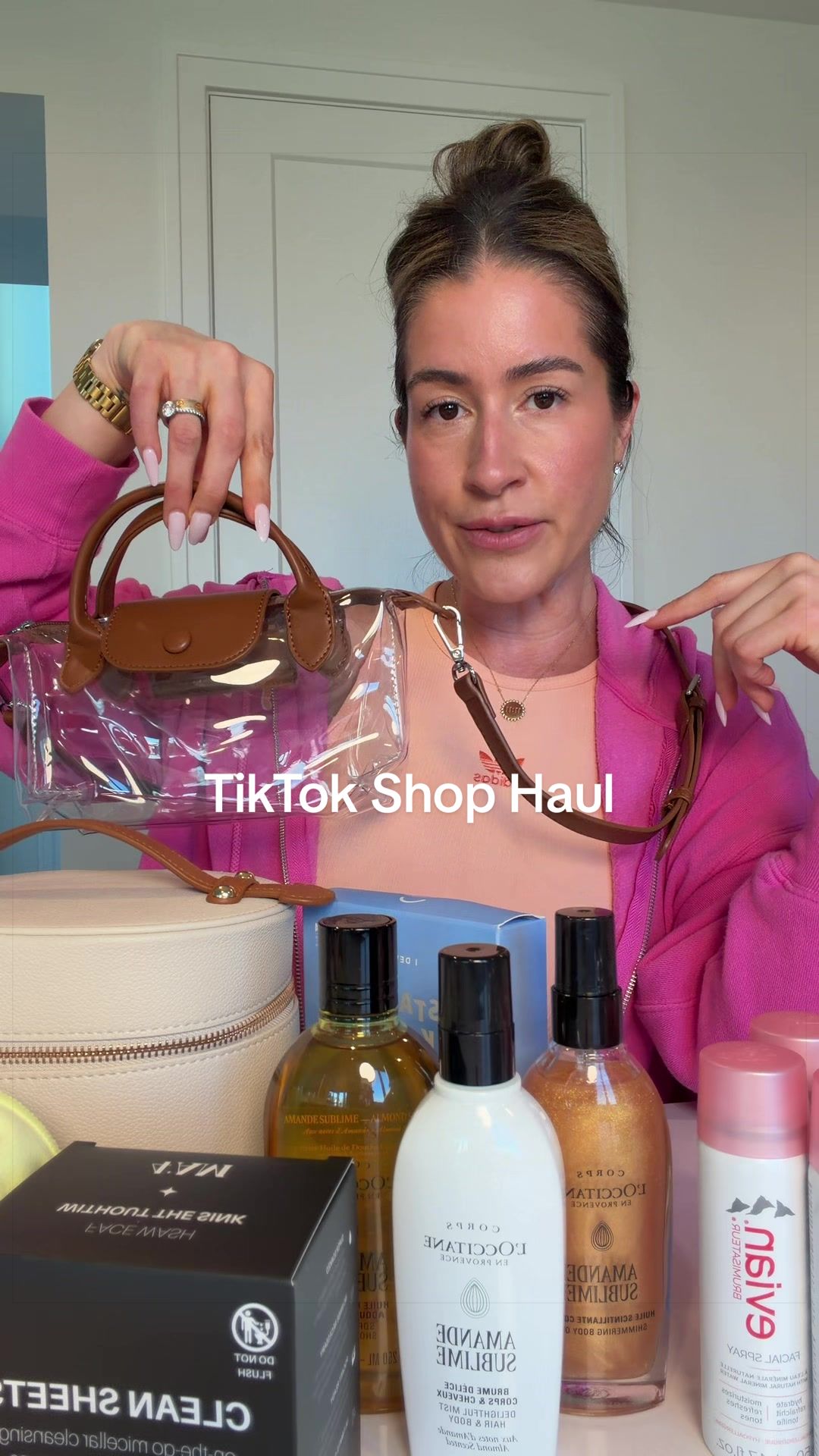 TikTok post by @kristinmarieclark for Evian Facial Spray USA. Caption reads: TikTok shop haul💖 @LOCCITANE @Evian Facial Spray....