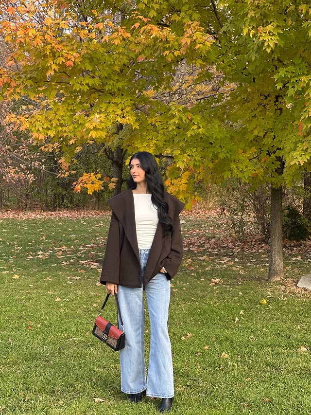 Instagram post by @komalpreetkaaur for callitspring. Caption reads: [...] @lyfrel.official
Bag @coach
Boots....