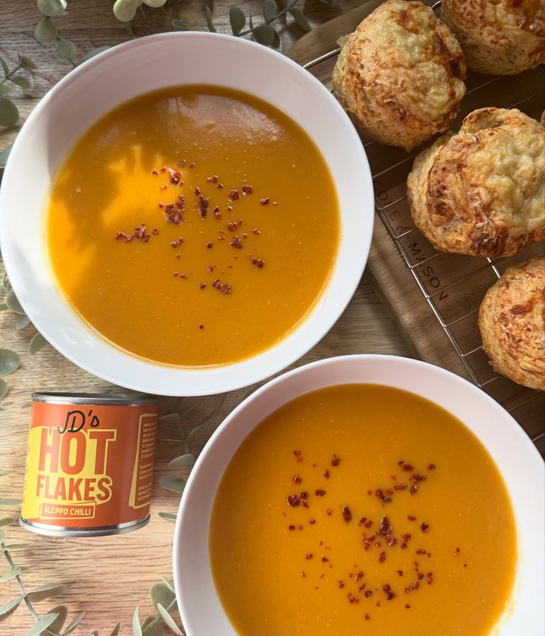 Instagram post by @foodyjudie for JD’s Hot Honey. Caption reads: Butternut squash & sweet potato soup with cheese....