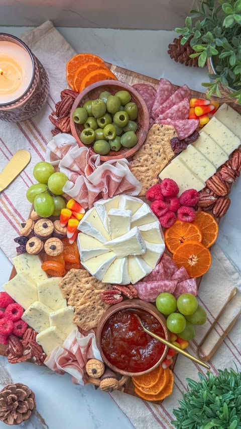 Instagram post by @charcuterie_n_things for Crunchmaster Crackers. Caption reads: [...] out on game day! On this build:....