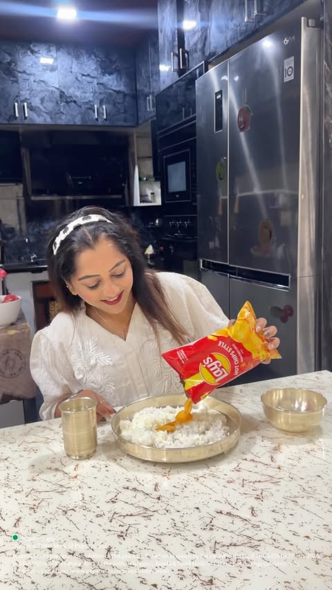 Instagram post by @makeup_artist_sowmya_devanga for Lay's. Caption reads: [...] Curd Rice + Lay’s hot chips!! #YMjingles....