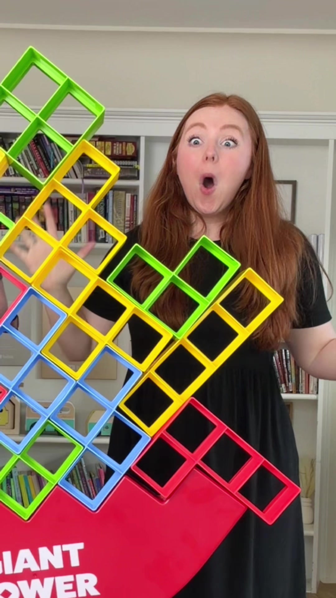 TikTok post by @hannahandregal for What Do You Meme?. Caption reads: Do you think we can do it 🤣 Giant tower stack is....